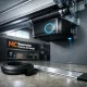 Interior de garaje con puerta automática en movimiento, mostrando tecnología y diseño; Cuales son las tendencias actuales en puertas de garaje automaticas en Madrid.